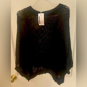 Womens NWT black poncho. Size Medium Brand is Jollycode